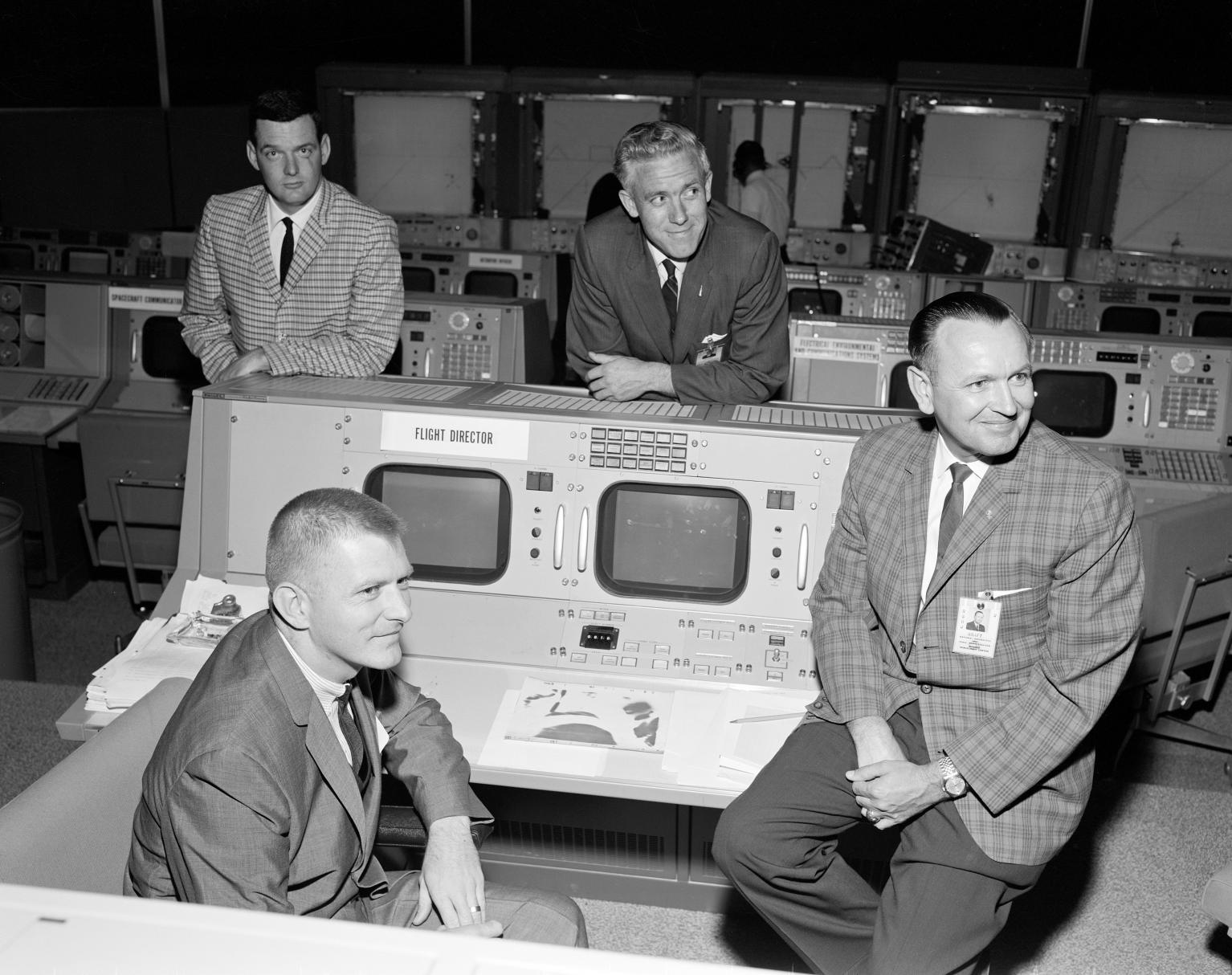 Flight Directors Lunney, Kraft, Hodge, and Kranz in Mission Control Flight Directors Lunney, Kraft, Hodge, and Kranz in Mission Control