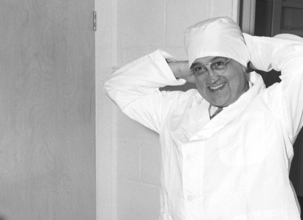 Dr. Draper Putting On Clean Room Suit