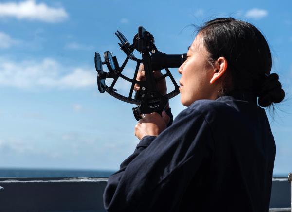 Navy Officer Uses Sextant During Training Exercise