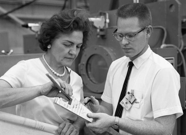 Margaret Hap Brennecke reviews blueprints at NASA Margaret Hap Brennecke reviews blueprints at NASA