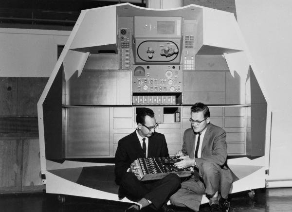 Ragan & Hall Seated In Front Of A Mock-up Of Apollo Controls