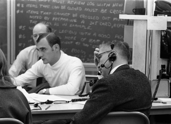Hamilton, Schmidt, Sears, Latts, and Hall Talking Around A Table