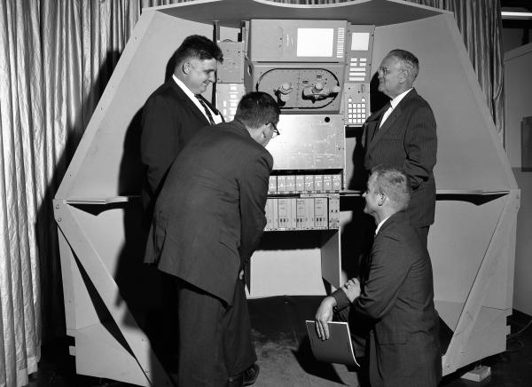 Engineers with Mock-Up of the Apollo Primary Guidance, Navigation, and Control System Engineers with Mock-Up of the Apollo Primary Guidance, Navigation, and Control System