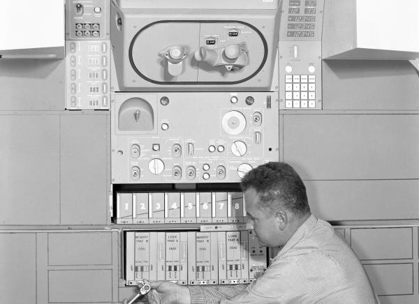 Engineer Donald Hall Installing Memory and Logic Trays Engineer Donald Hall Installing Memory and Logic Trays