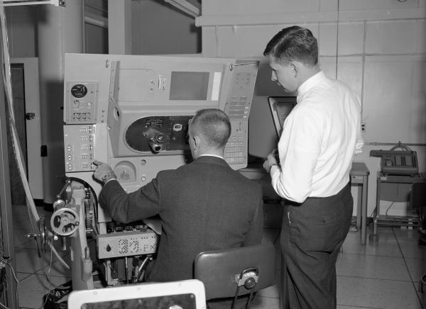 Ain Laats Instructing an Astronaut on the Primary Guidance, Navigation, and Control System. Ain Laats Instructing an Astronaut on the Primary Guidance, Navigation, and Control System.