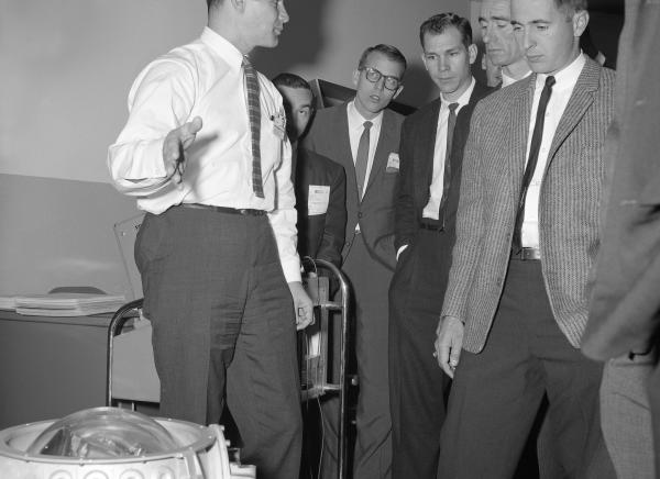 Apollo Astronauts and MIT Engineer Manny Kramer with the IMU Apollo Astronauts and MIT Engineer Manny Kramer with the IMU