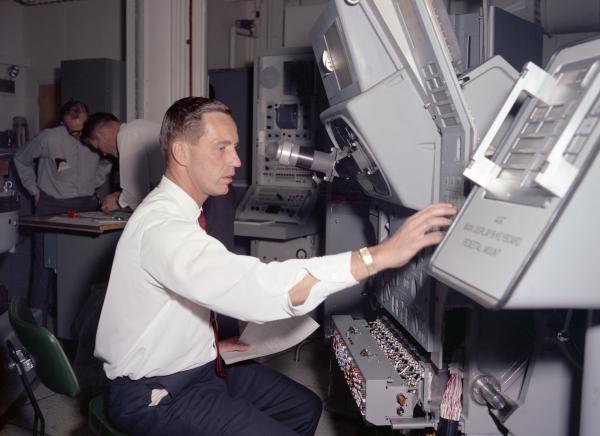 Apollo Astronaut Donn Eisele with the Primary Guidance, Navigation, and Control System Apollo Astronaut Donn Eisele with the Primary Guidance, Navigation, and Control System