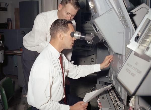 Apollo Astronaut Donn Eisele with the Primary Guidance, Navigation, and Control System Simulator Apollo Astronaut Donn Eisele with the Primary Guidance, Navigation, and Control System Simulator