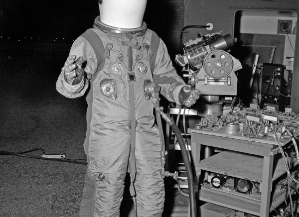 Astronaut in Spacesuit Testing Relief Optics for Apollo Guidance & Navigation System Astronaut in Spacesuit Testing Relief Optics for Apollo Guidance & Navigation System
