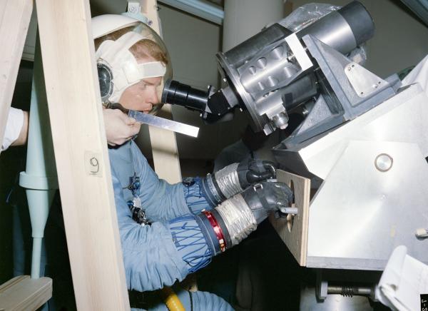 Astronaut in Space Suit Tests Optics Eye Relief Astronaut in Space Suit Tests Optics Eye Relief