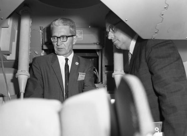 Aleksandr Mikhaĭlovich Letov and Jim Nevins Inside the Command Module Simulator