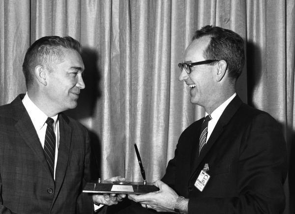 Ralph Ragan Awarding Norm Sears with the Apollo 3% Cost Reduction Award