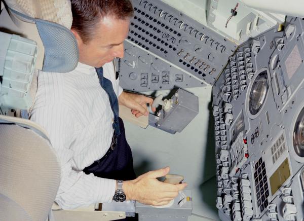 Astronaut Lovell in Command Module Simulator 