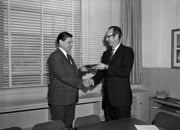 Ain Laats Receiving Cost Reduction Award from Ralph Ragan