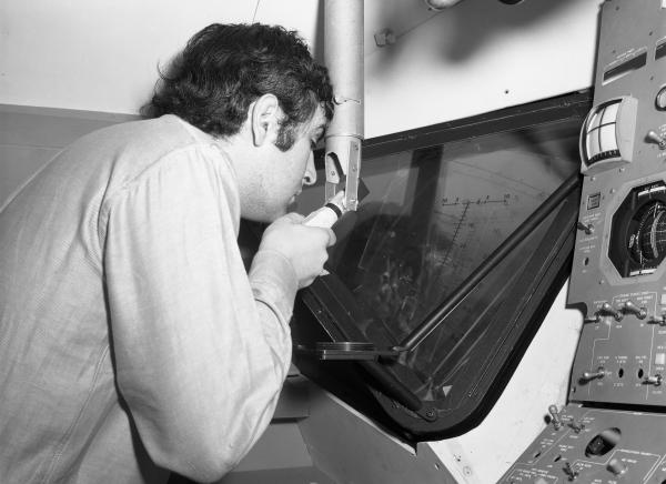 Man Viewing Launching Sight Designator in Apollo LEM