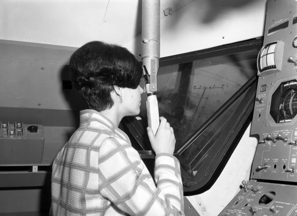 Woman Viewing Launching Sight Designator in Apollo LEM
