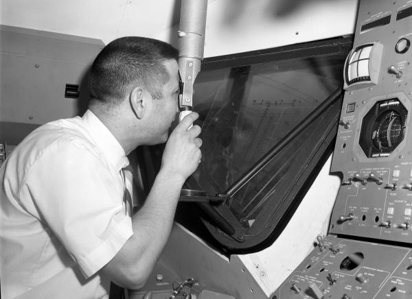 Engineer Joseph Martori Viewing Launching Sight Designator in Apollo LEM