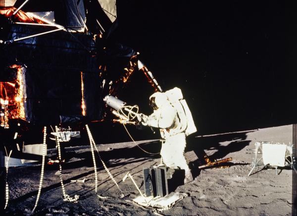Apollo 12 Astronaut with Scientific Equipment on the Lunar Surface