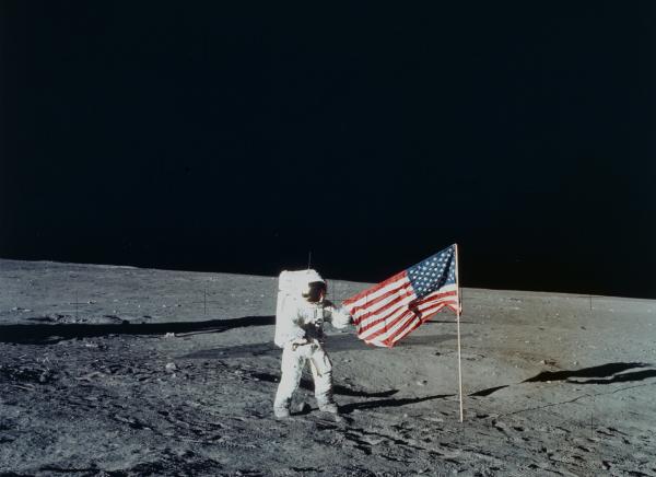 Apollo 12 Astronaut Charles Conrad with Flag